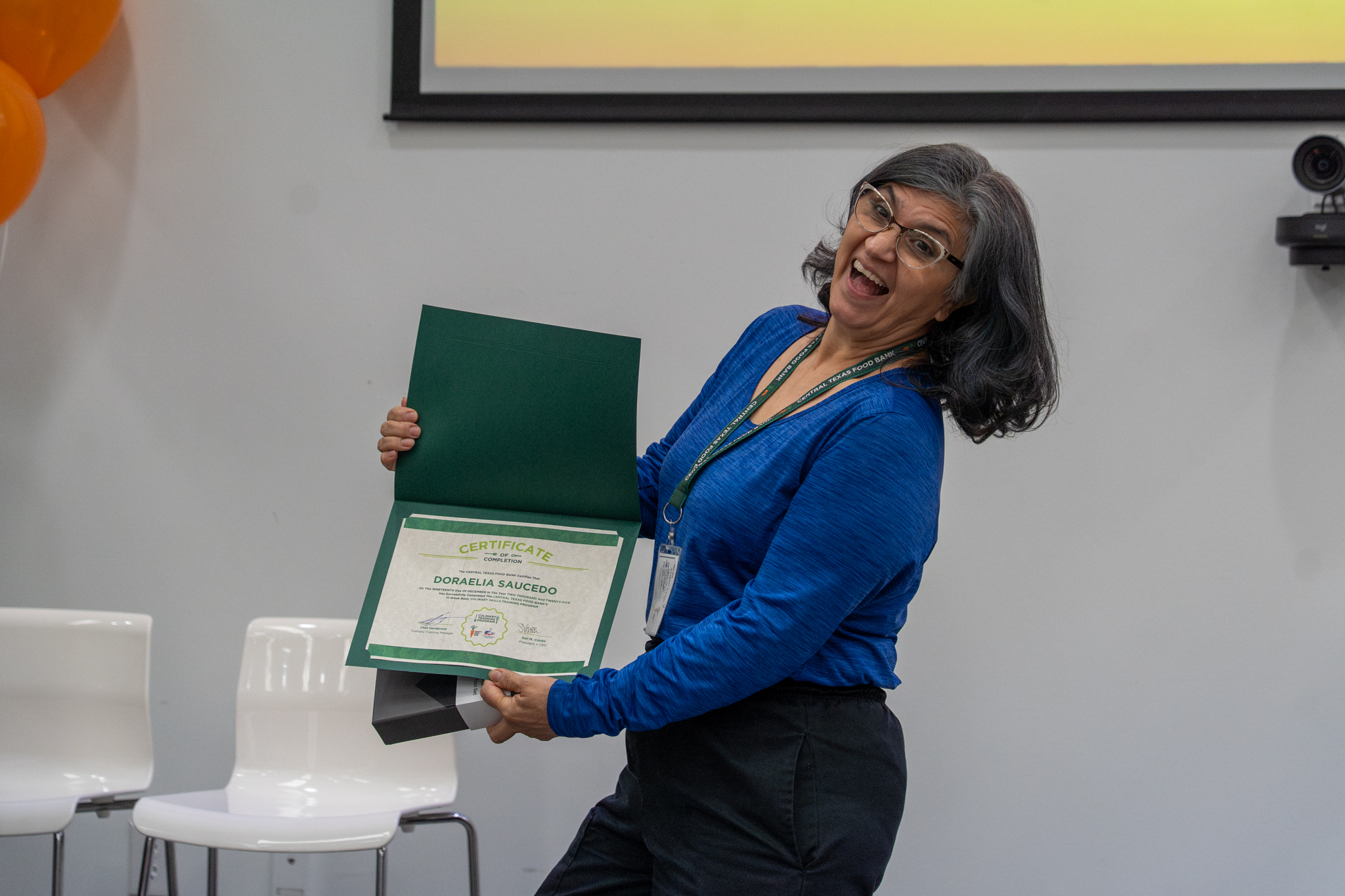 Student with certificate from CTFBs Culinary Training Program